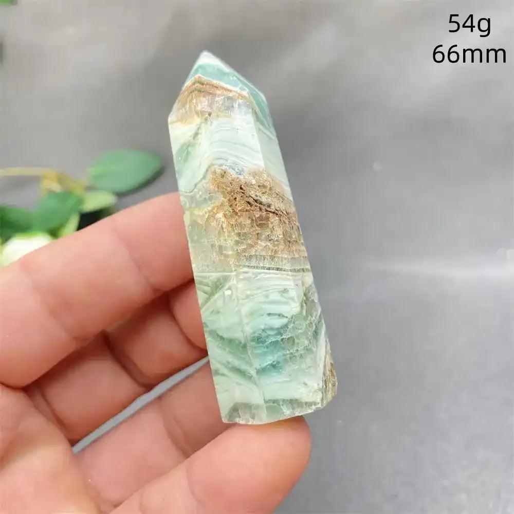 Hand-polished Green Calcite tower with soft green banding and natural veils for Heart chakra balance and renewal.