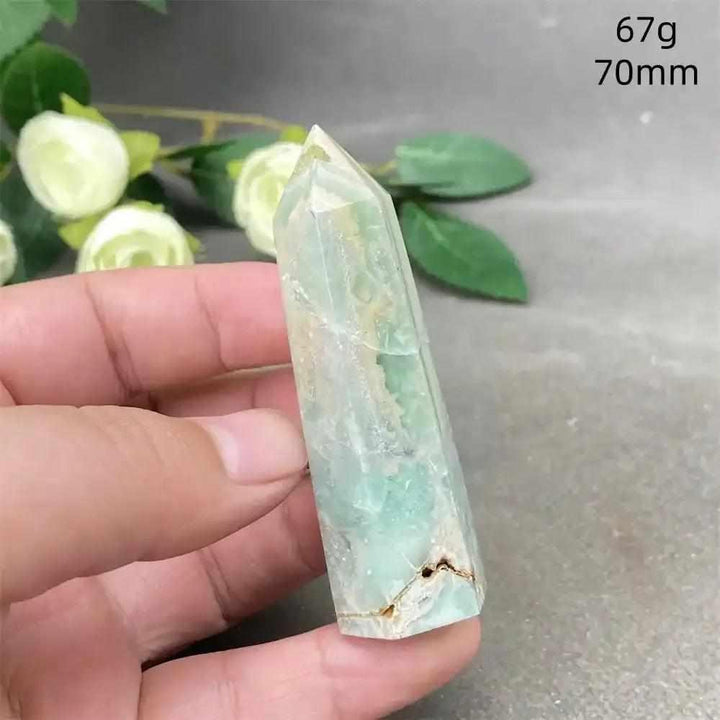 Hand-polished 70mm Green Calcite tower with soft green banding and natural veils for Heart chakra healing and renewal.