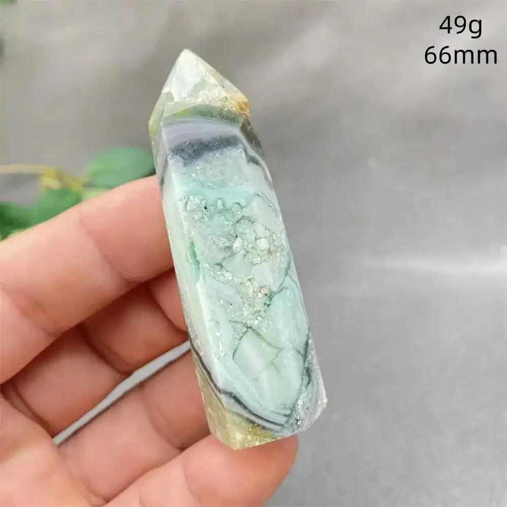 Hand-polished Green Calcite tower with soft green banding and natural veils for Heart chakra healing and renewal.
