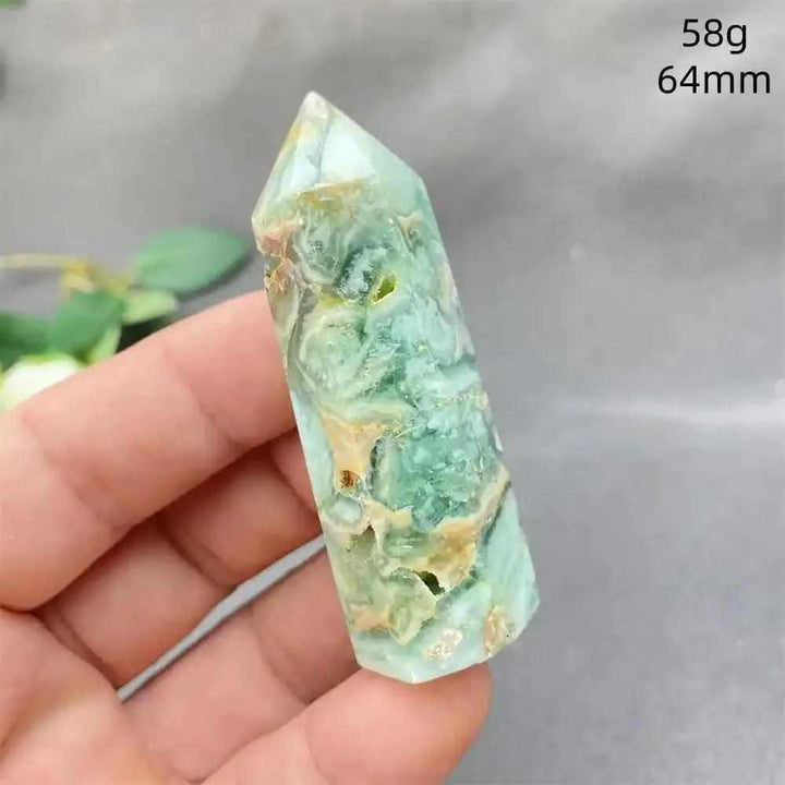 Hand-polished Green Calcite tower with soft green banding and natural veils, perfect for Heart chakra healing and balance.