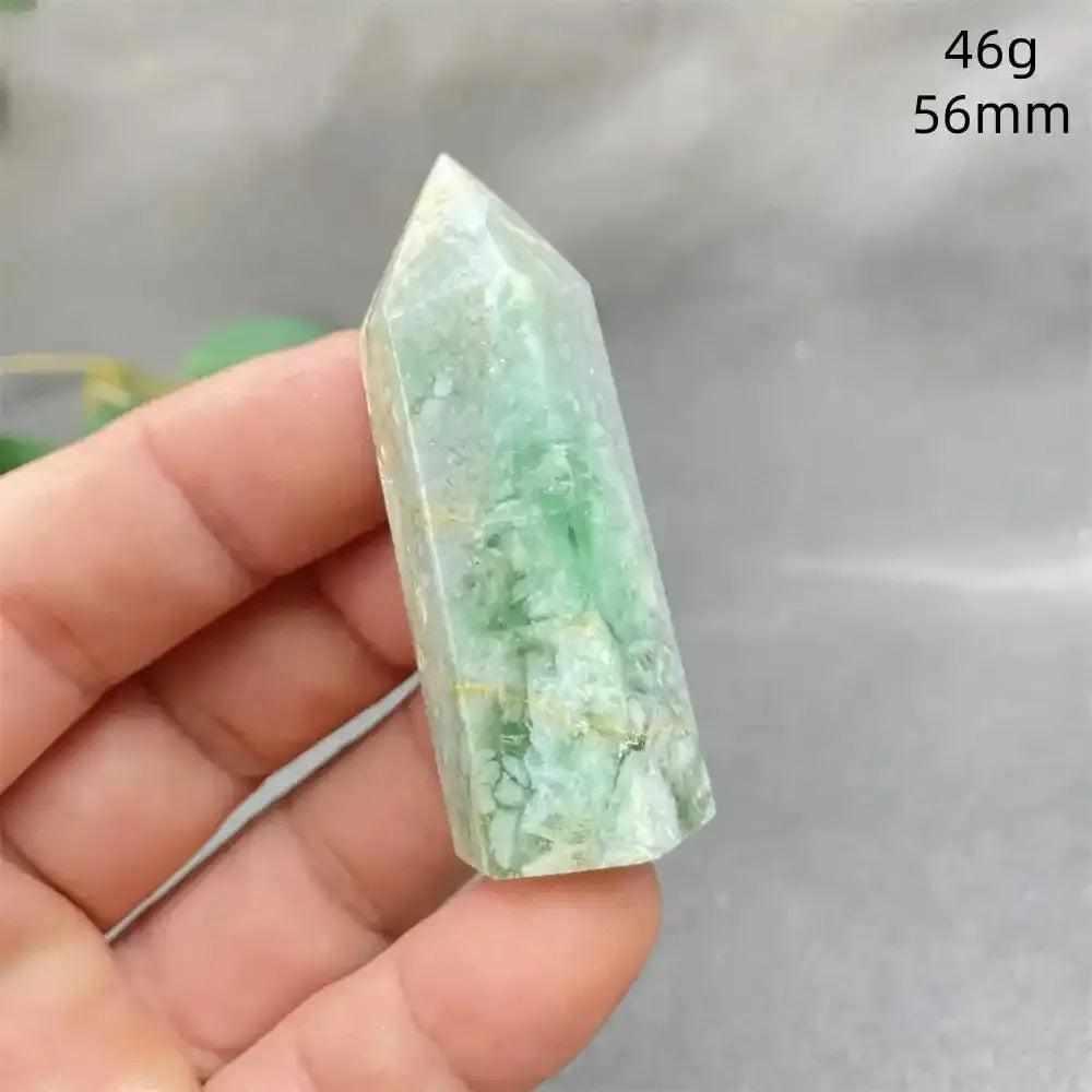 Hand-polished Green Calcite tower with natural banding and a waxy glow, perfect for Heart chakra healing and meditation.