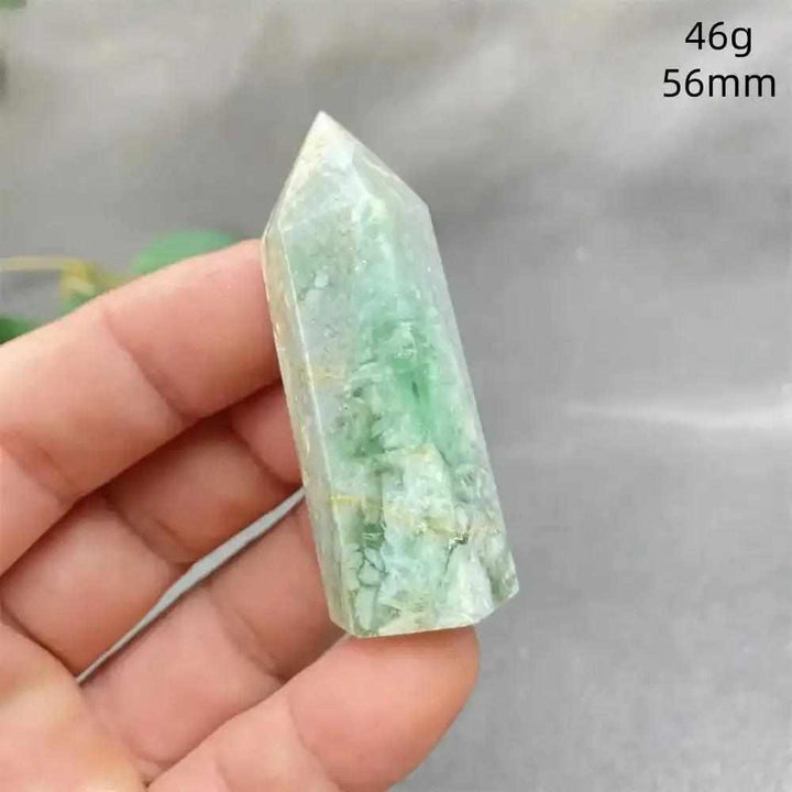 Hand-polished Green Calcite tower with natural banding and a waxy glow, perfect for Heart chakra healing and meditation.