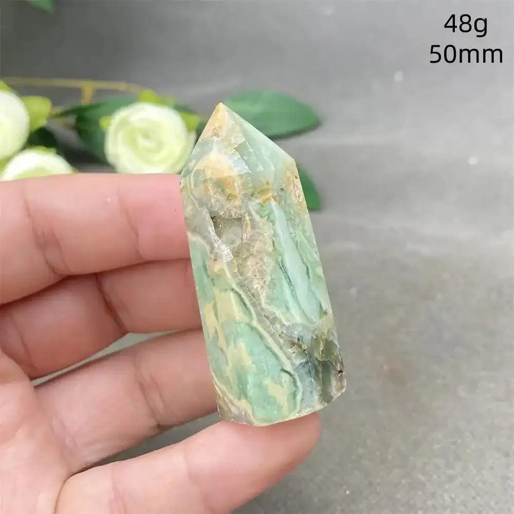 Hand-polished Green Calcite tower with soft green banding and natural veils, perfect for Heart chakra healing and balance.