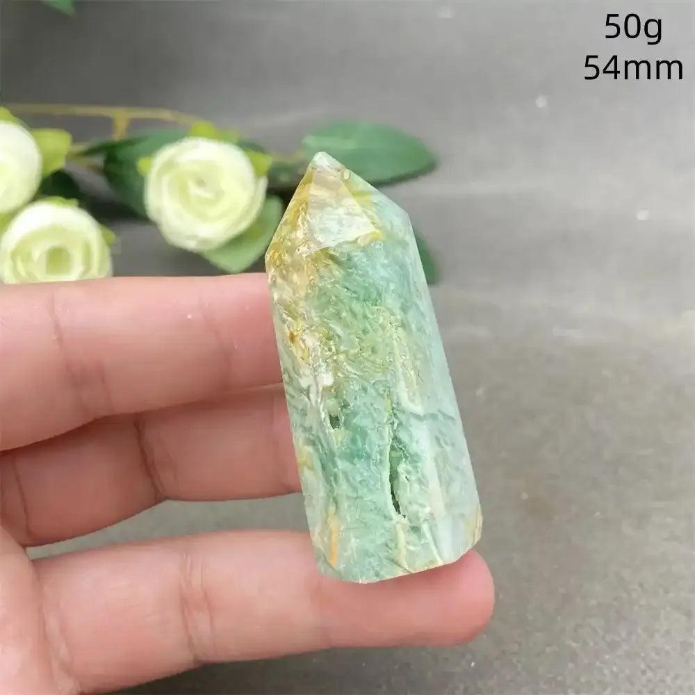 Hand-polished Green Calcite tower with soft green banding and natural veils, perfect for Heart chakra healing and balance.