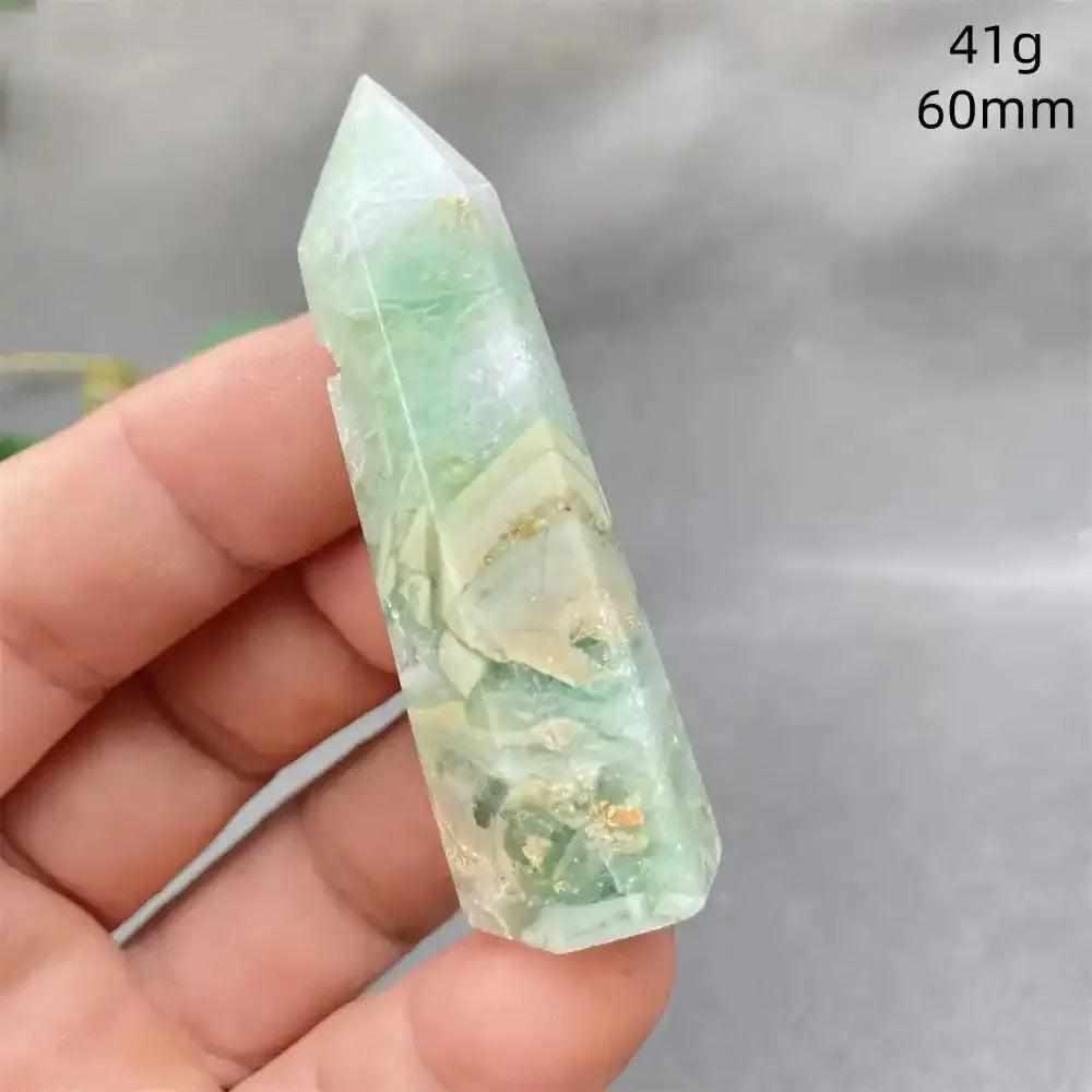 Hand-polished Green Calcite tower with soft green banding, natural veils, and a faceted point for Heart chakra healing.
