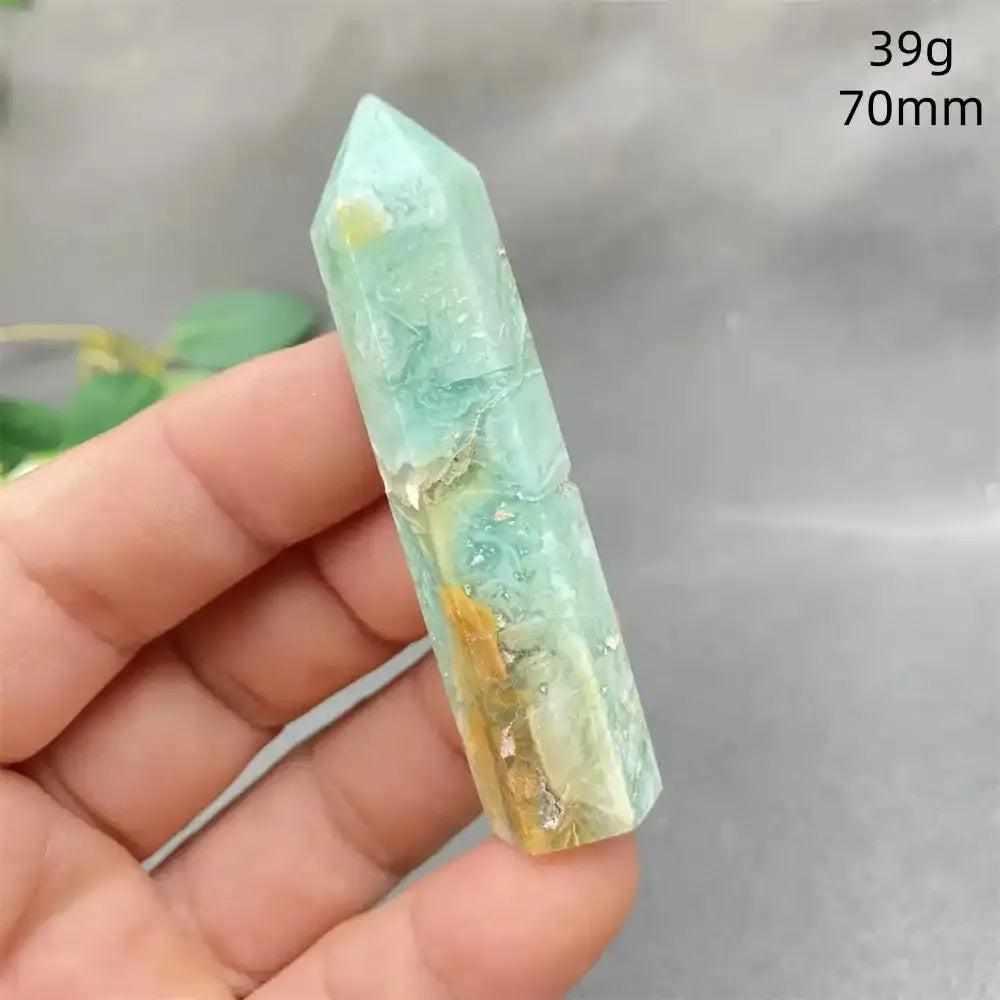 Hand-polished Green Calcite tower with natural banding, waxy glow, and faceted point for Heart chakra healing and balance.