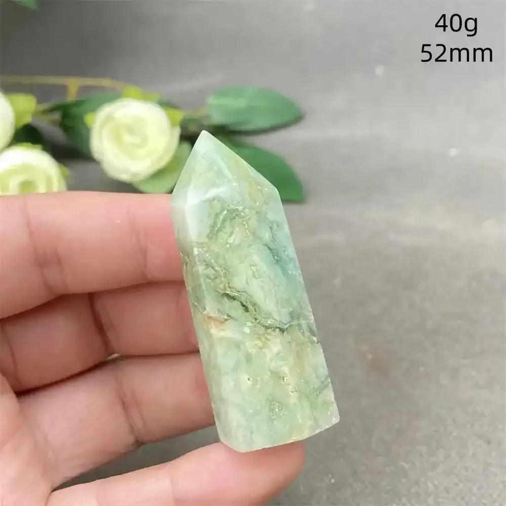 Hand-polished Green Calcite tower with soft green banding and a faceted point for Heart chakra healing and renewal.