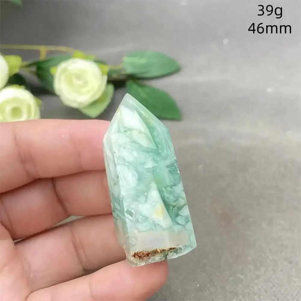 Hand-polished Green Calcite tower with soft green banding and a faceted point for Heart chakra renewal and balance.