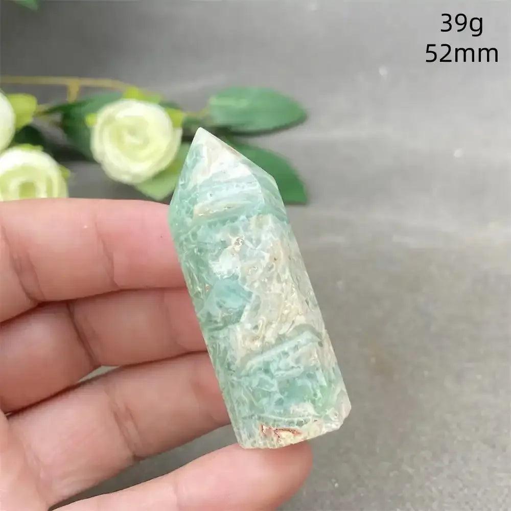 Hand-polished Green Calcite tower with soft green banding, ideal for Heart chakra healing and calming meditation spaces.