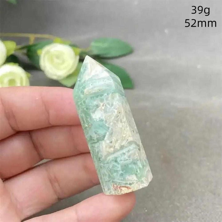 Hand-polished Green Calcite tower with soft green banding, ideal for Heart chakra healing and calming meditation spaces.