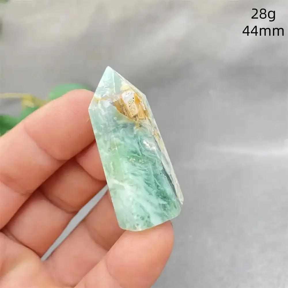 Hand-polished Green Calcite tower with soft green banding, natural veils, and a faceted point for Heart chakra healing.