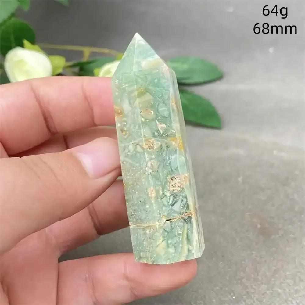 Hand-polished Green Calcite tower with soft green banding and a faceted point for Heart chakra renewal and balance.