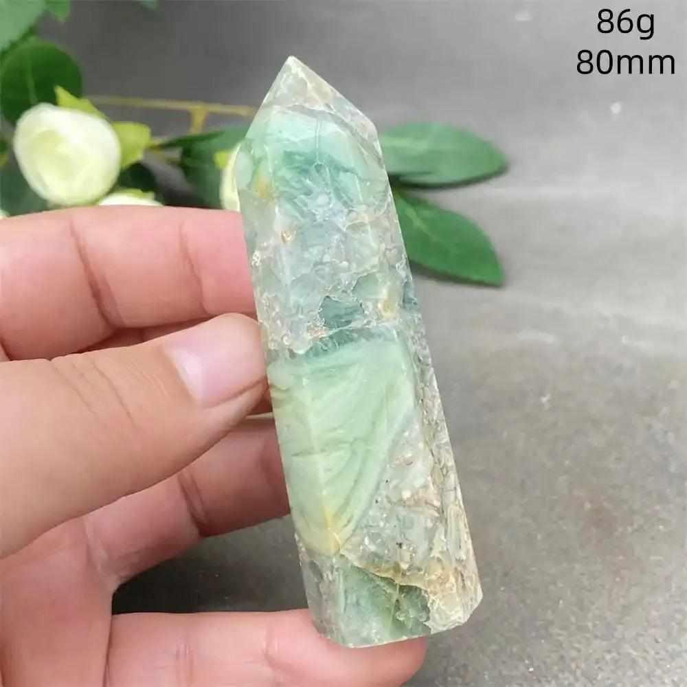 Hand-polished Green Calcite tower with natural banding, waxy glow, and faceted point for Heart chakra meditation.