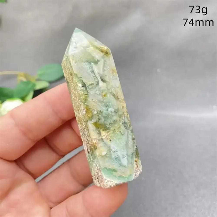 Hand-polished Green Calcite tower with natural banding and a faceted point for Heart chakra healing and emotional balance.