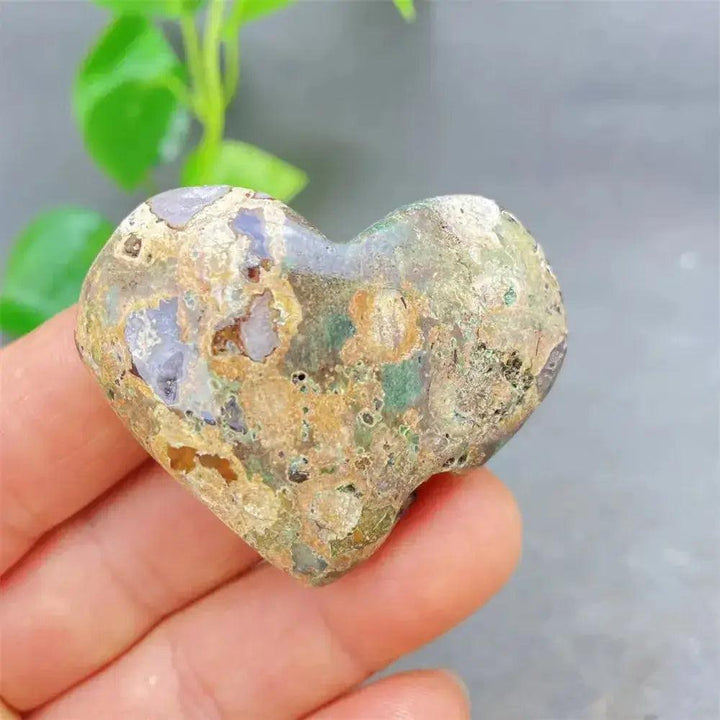 Green Cherry Agate Heart Crystal: Smooth, polished heart-shaped stone with soft green, brown, and purple tones for emotional balance.