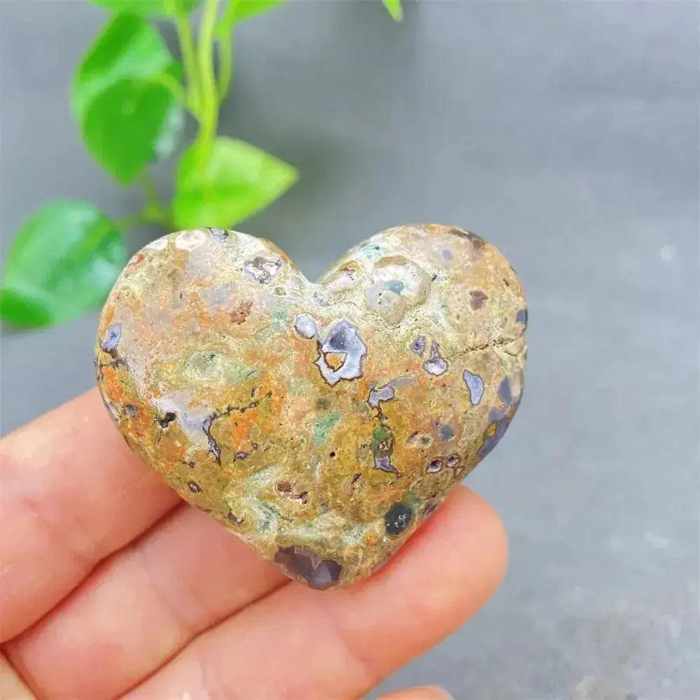 Green Cherry Agate Heart Crystal: Smooth, polished heart-shaped stone with soft green, orange, and purple inclusions.