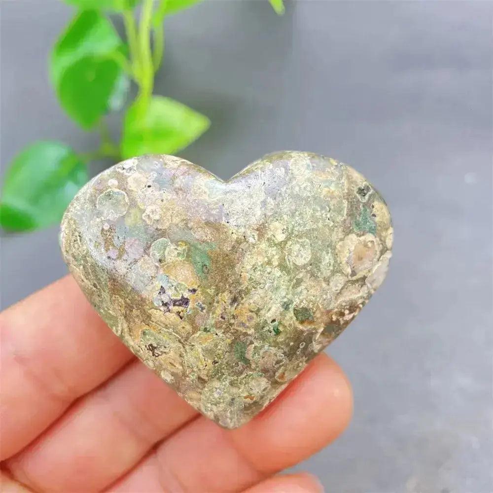 Green Cherry Agate Heart Crystal: Smooth, heart-shaped stone with soft green tones and cherry-like inclusions, promoting emotional balance.