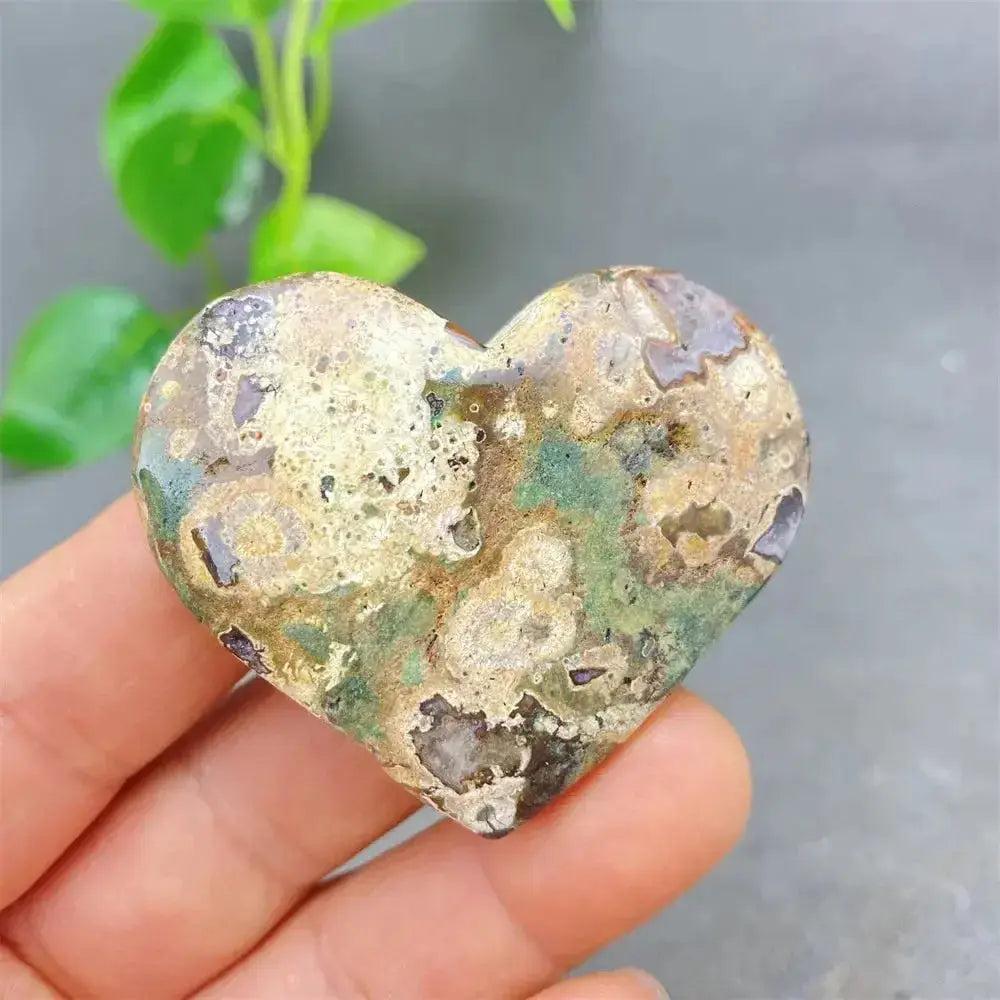 Green Cherry Agate Heart Crystal: Polished heart-shaped stone with soft green and cherry-like inclusions, promoting emotional balance.