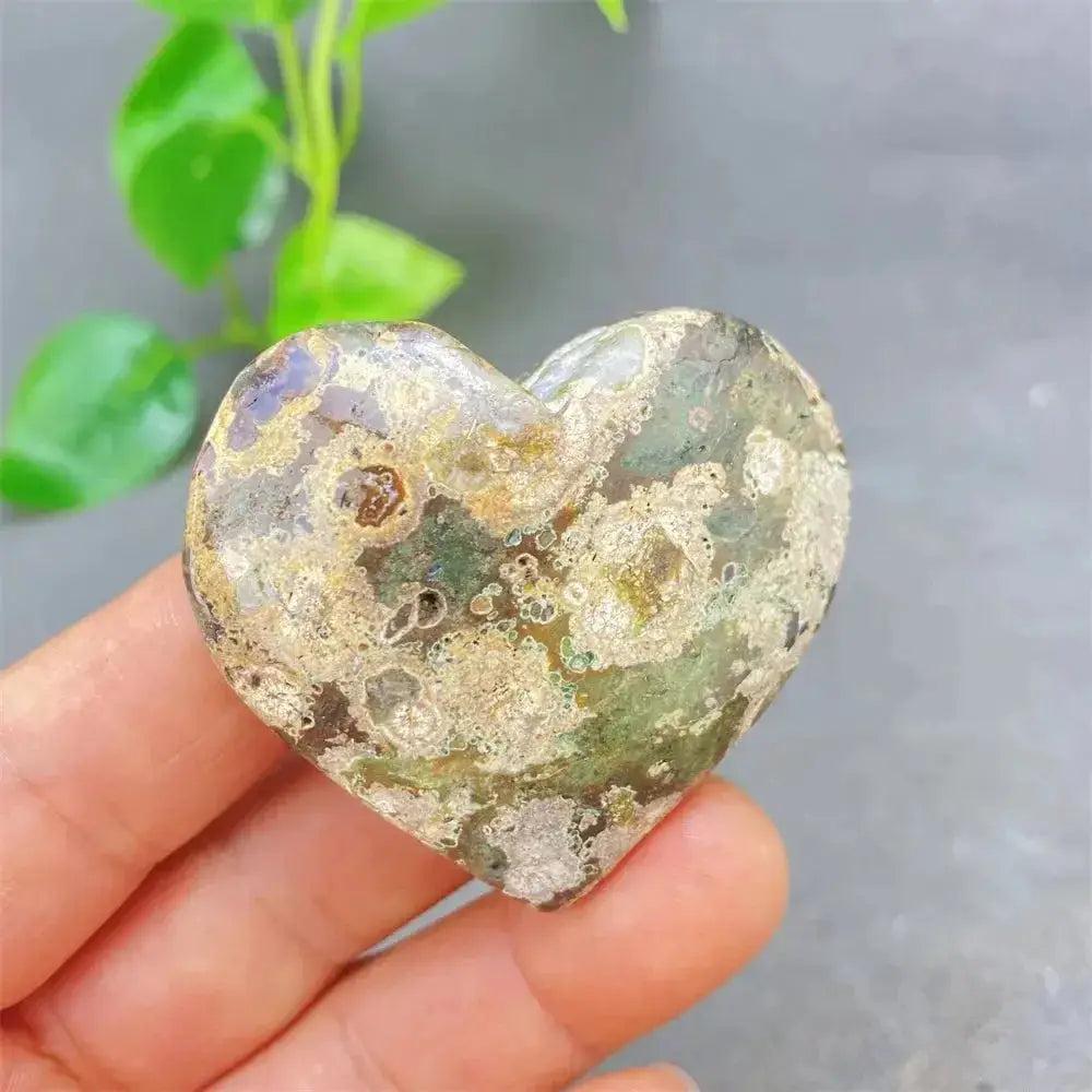 Green Cherry Agate Heart Crystal: unique, polished heart-shaped stone with soft green tones and cherry-like inclusions.