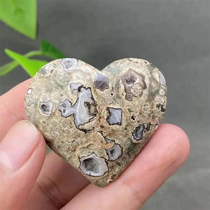 Green Cherry Agate Heart Crystal: Smooth, polished heart-shaped stone with soft green tones and unique cherry-like inclusions.