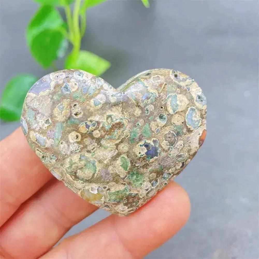 Green Cherry Agate Heart Crystal: unique heart-shaped stone with soothing green tones and cherry-like inclusions.