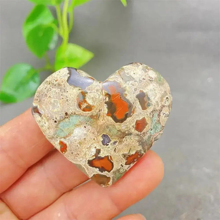 Green Cherry Agate Heart Crystal: unique heart-shaped stone with soft green, cherry-like inclusions, promoting emotional balance.