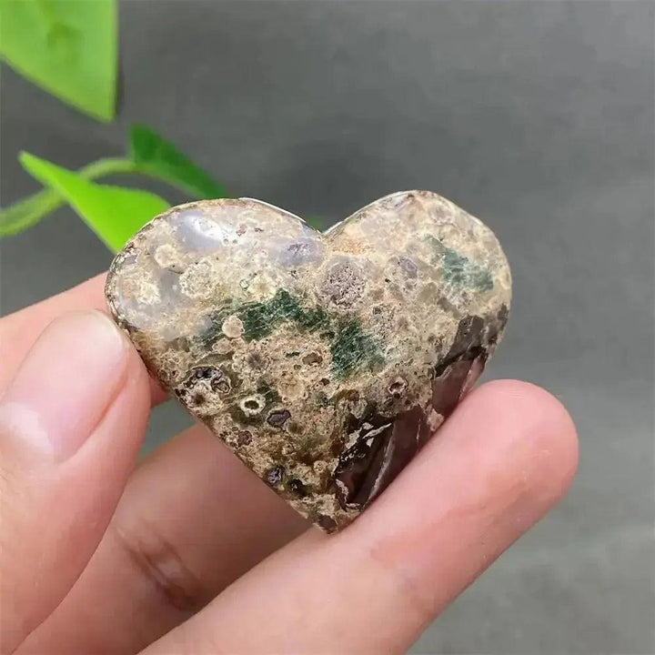 Green Cherry Agate Heart Crystal: Polished heart-shaped stone with soft green and cherry-like inclusions, promoting emotional balance.