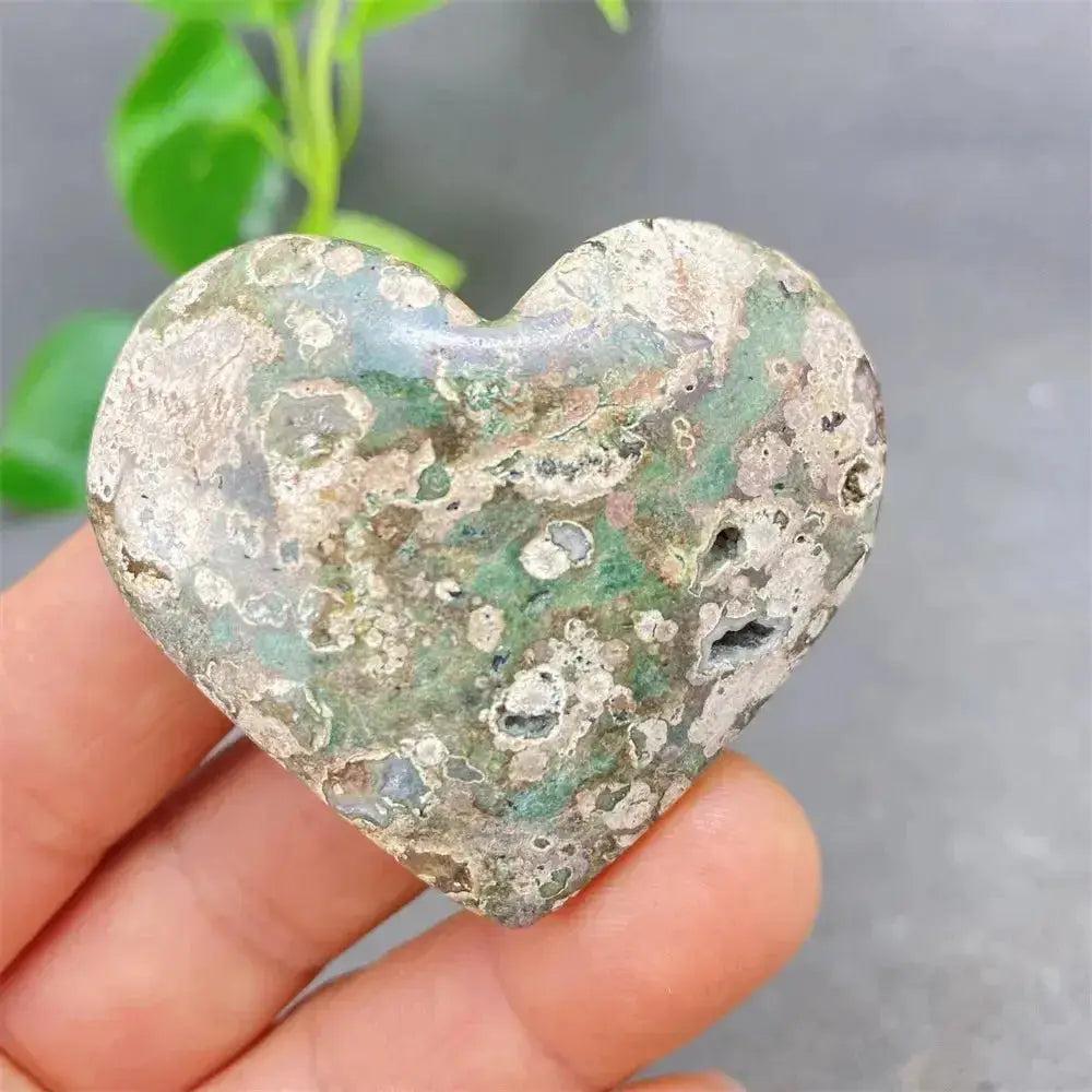 Green Cherry Agate Heart Crystal: Smooth, polished heart-shaped stone with soft green tones and cherry-like inclusions.