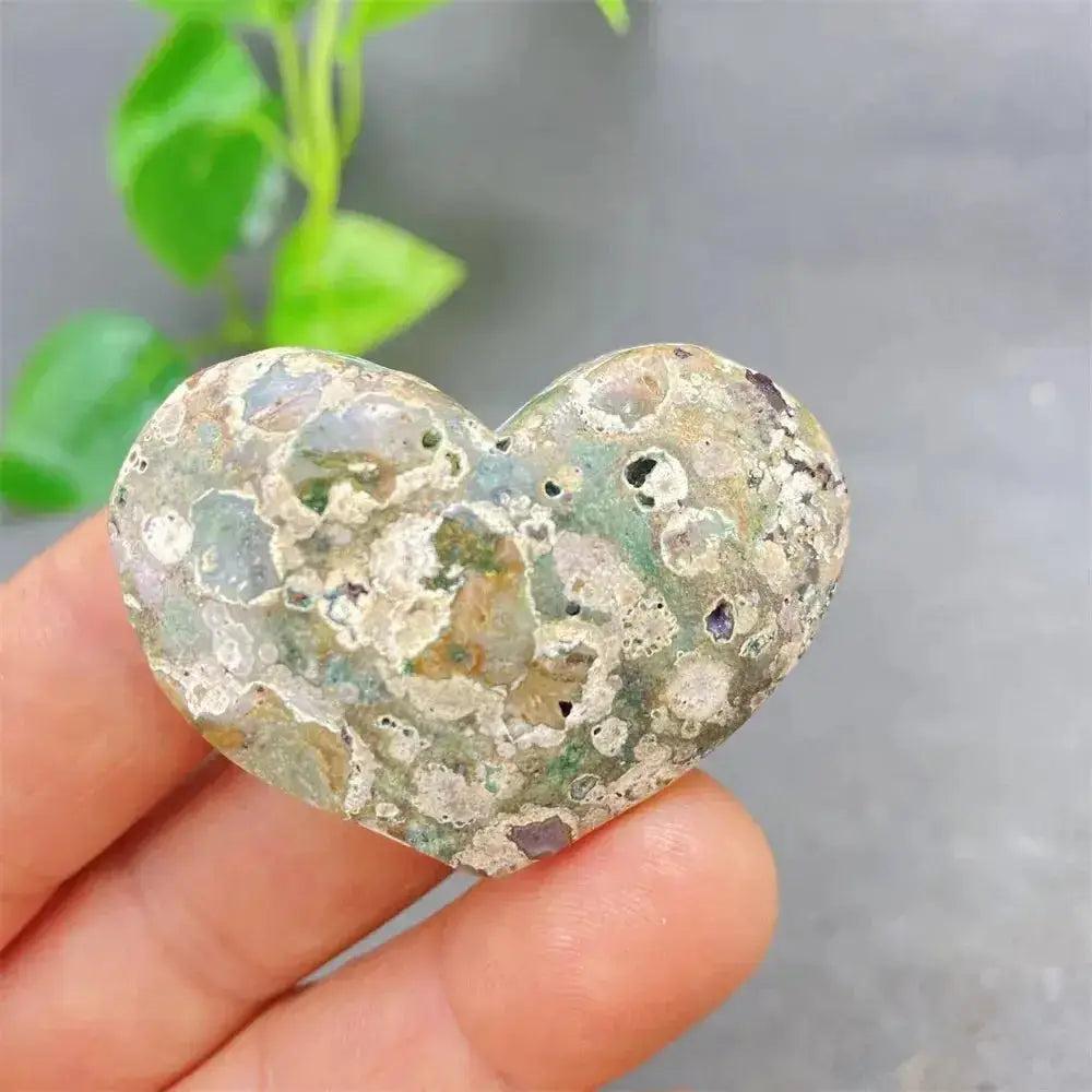 Green Cherry Agate Heart Crystal: unique heart-shaped stone with soft green tones, cherry inclusions, and organic patterns.