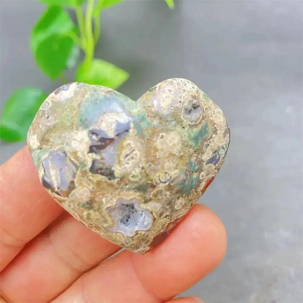 Green Cherry Agate Heart Crystal: unique, soothing heart-shaped stone with soft green tones and cherry-like inclusions.