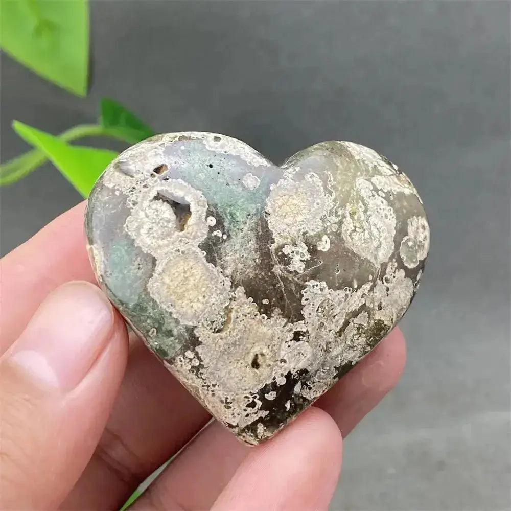 Green Cherry Agate Heart Crystal: Polished heart-shaped stone with soft green tones and cherry-like inclusions, promoting emotional balance.