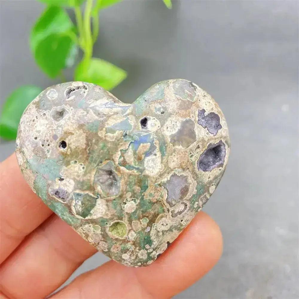 Green Cherry Agate Heart Crystal: unique heart-shaped stone with soft green tones, cherry inclusions, and natural druzy pockets.