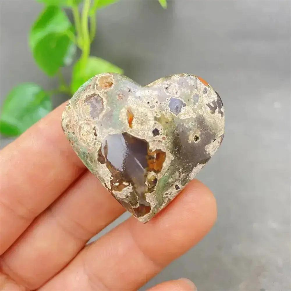 Green Cherry Agate Heart Crystal: Smooth, polished heart-shaped stone with soft green and cherry-like inclusions.