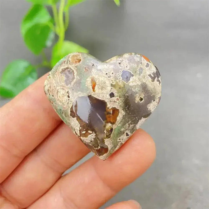 Green Cherry Agate Heart Crystal: Smooth, polished heart-shaped stone with soft green and cherry-like inclusions.
