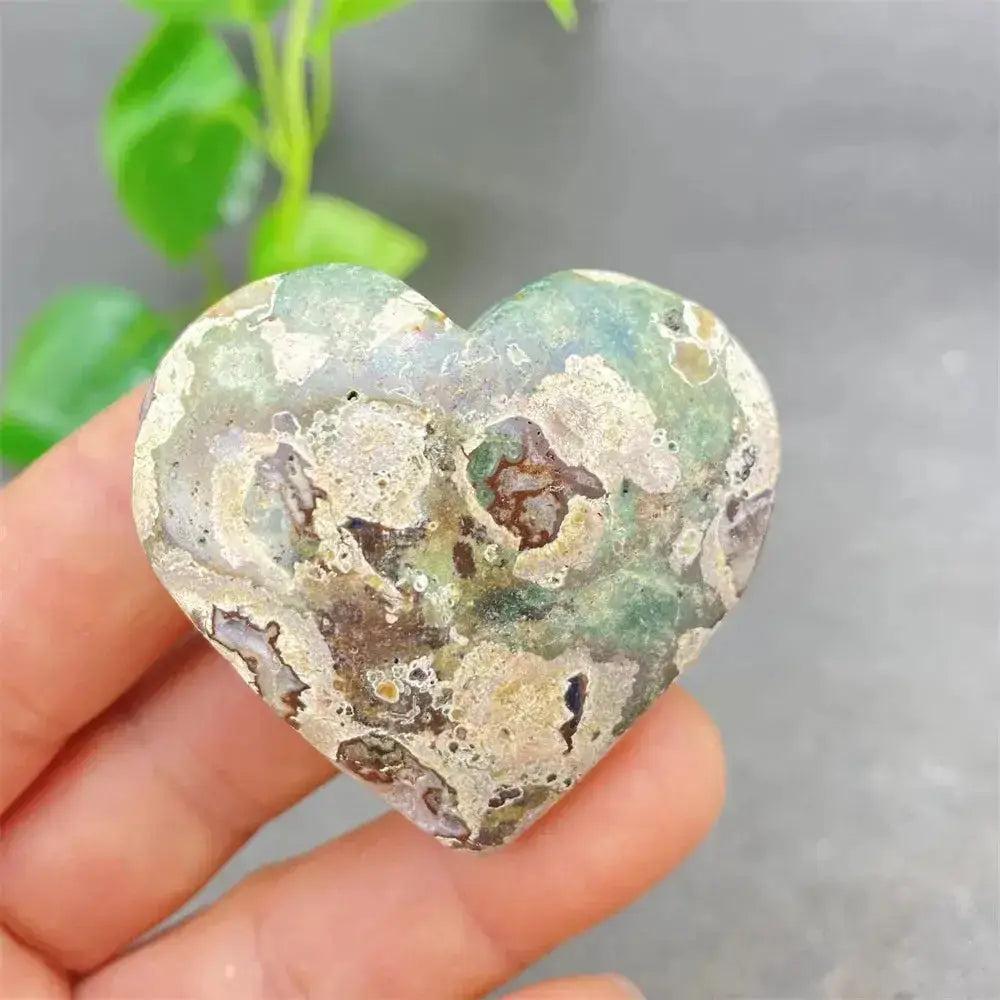 Green Cherry Agate Heart Crystal: Smooth, polished heart-shaped stone with soft green and cherry-like inclusions.