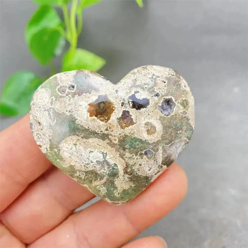 Green Cherry Agate Heart Crystal: unique heart-shaped stone with soft green tones, cherry inclusions, and organic patterns.