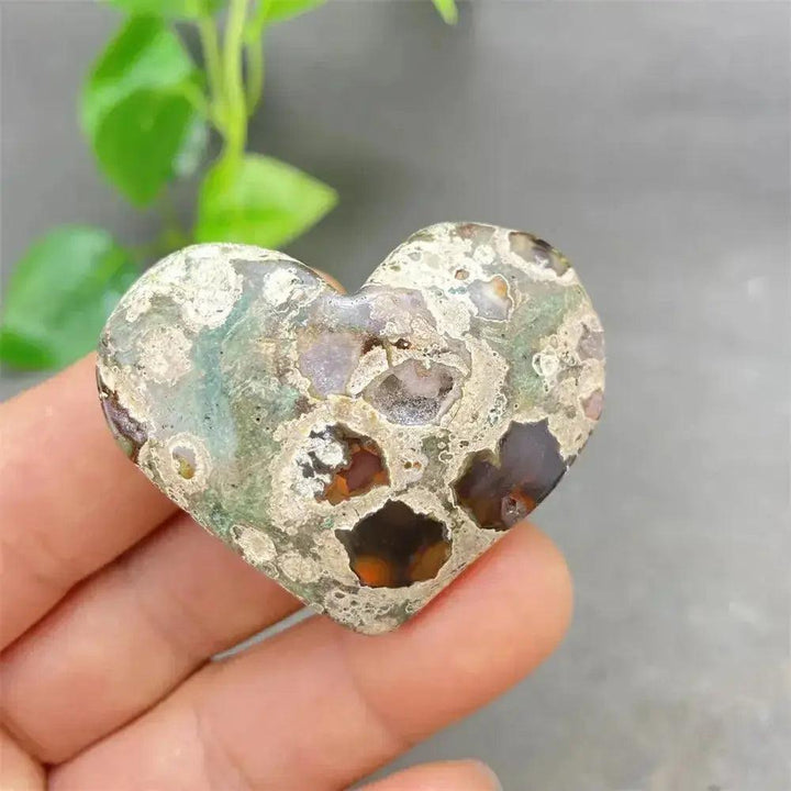 Green Cherry Agate Heart Crystal: unique heart-shaped stone with soothing green tones and cherry-like inclusions.