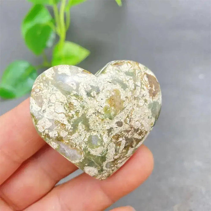 Green Cherry Agate Heart Crystal: Smooth, polished heart-shaped stone with soft green tones and cherry-like inclusions.
