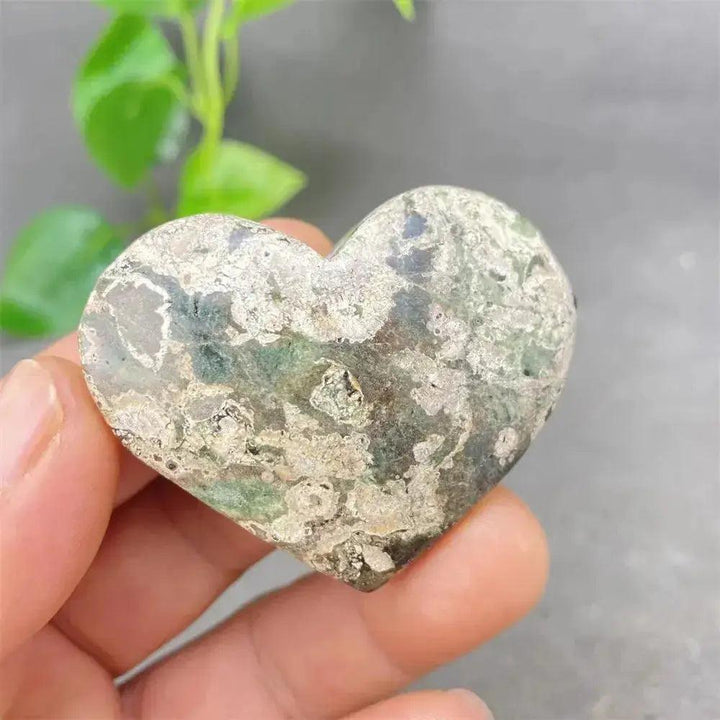 Green Cherry Agate Heart Crystal: Smooth, polished heart-shaped stone with soft green tones and subtle cherry-like inclusions.