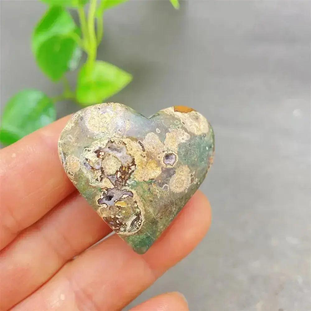 Green Cherry Agate Heart Crystal: Smooth, polished heart-shaped stone with soft green tones and cherry-like inclusions.