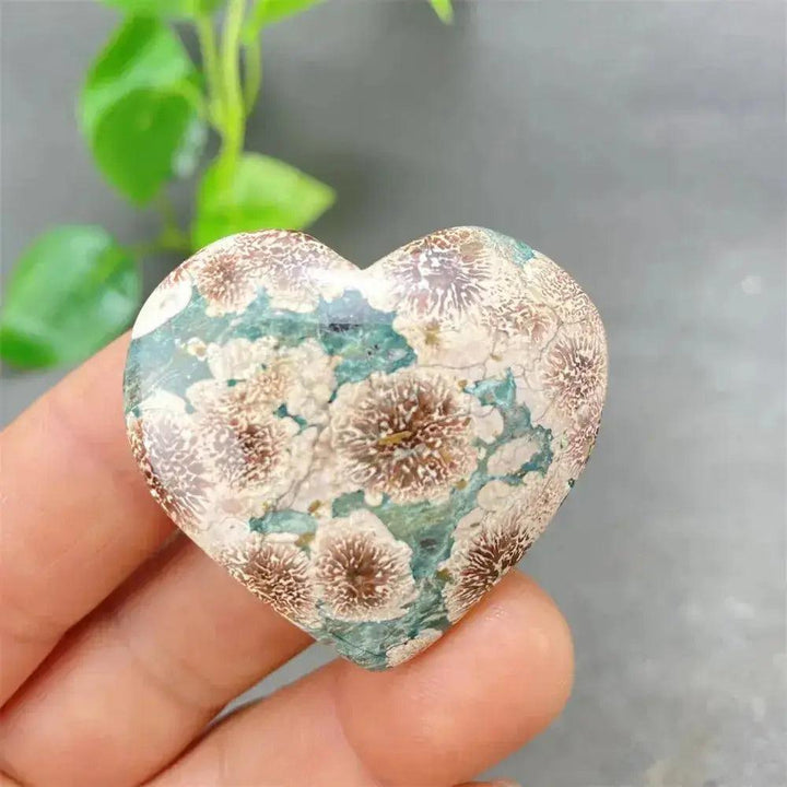 Green Cherry Agate Heart Crystal: Polished heart-shaped stone with soft green and cherry-like floral inclusions.