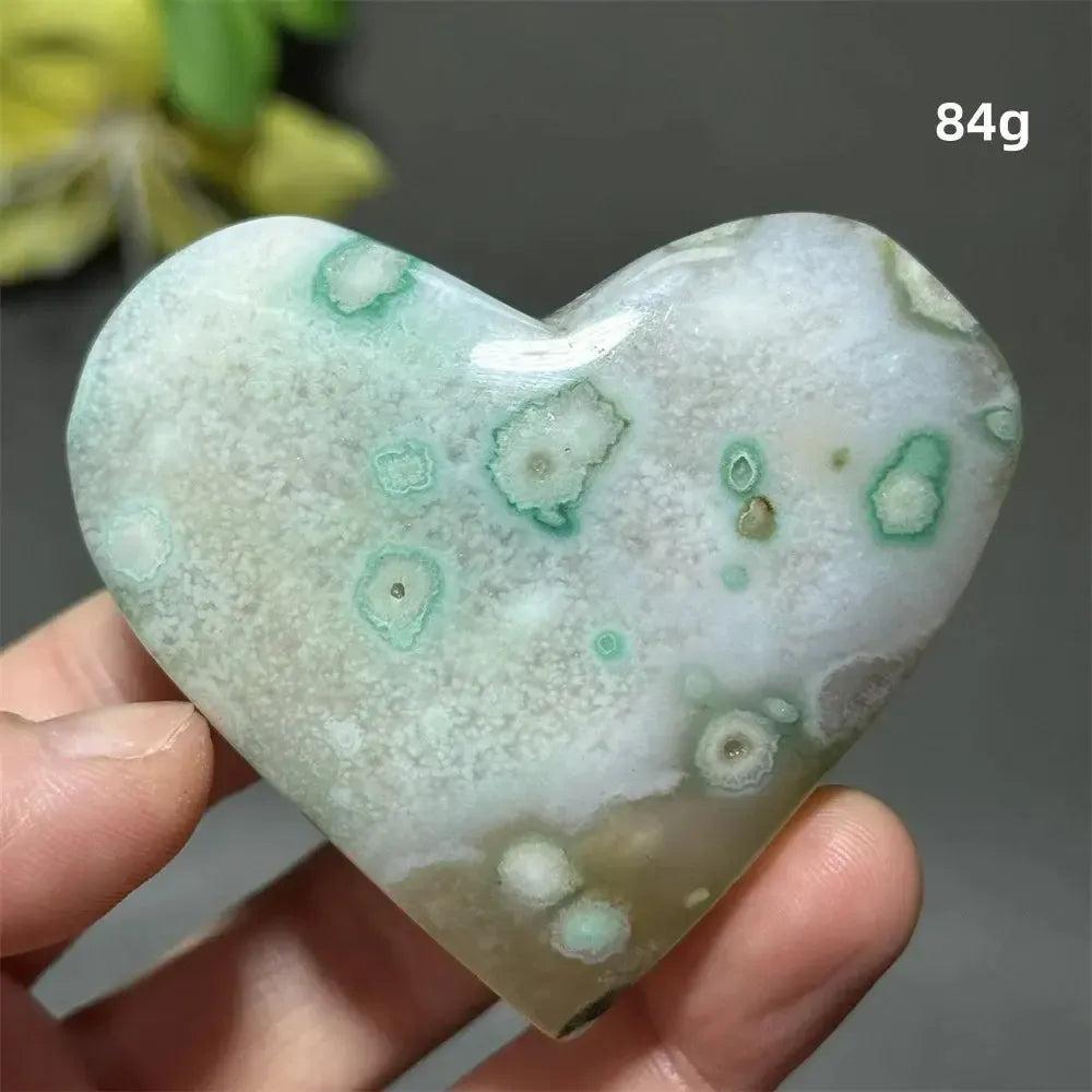 Green Cherry Agate Crystal Heart: Polished, heart-shaped stone with mint green and white flower-like patterns for growth and self-love.