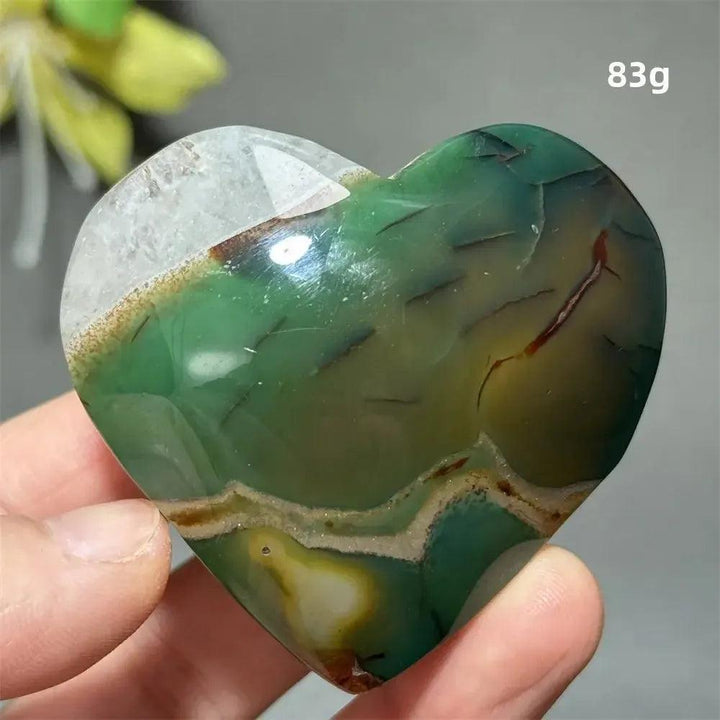 Green Cherry Agate Crystal Heart, 83g, with unique flower-like plumes and cherry blossom patterns, promoting growth and self-love.