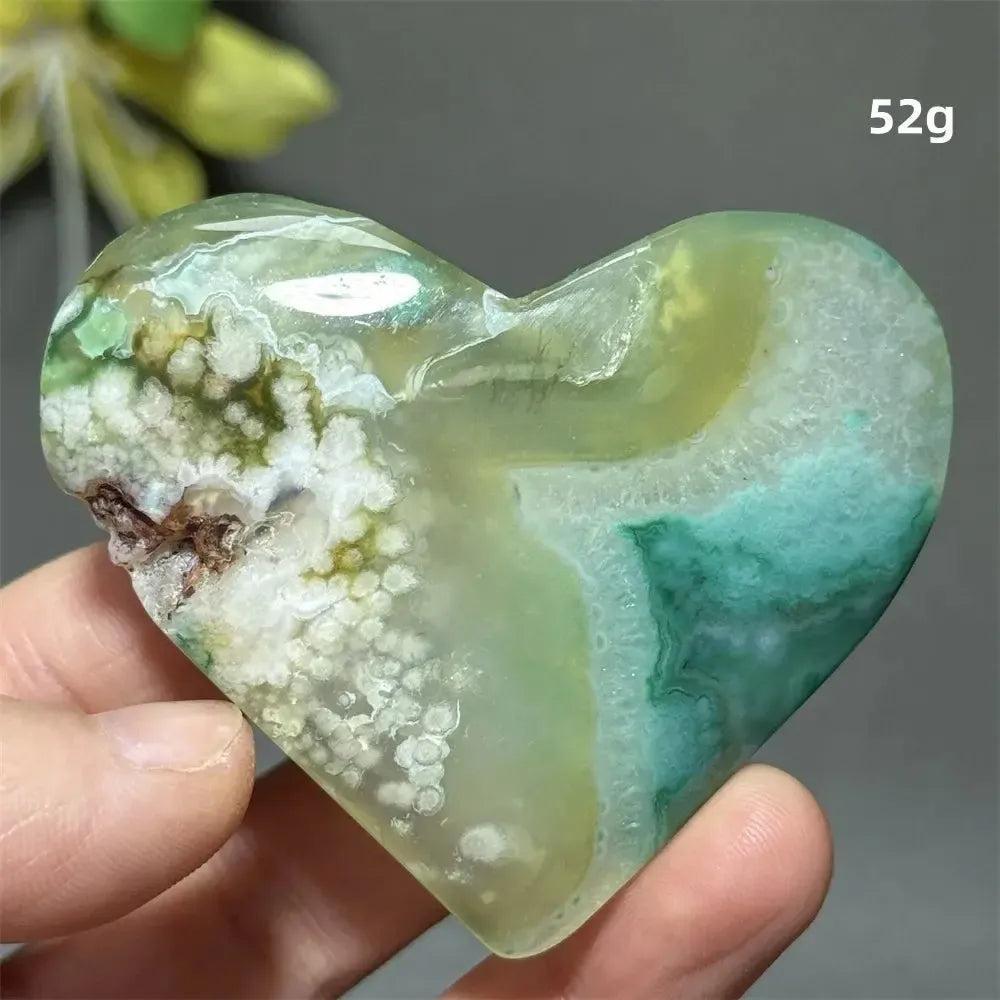 Green Cherry Agate Crystal Heart, 52g, with soft green hues, flower-like plumes, and a polished finish.