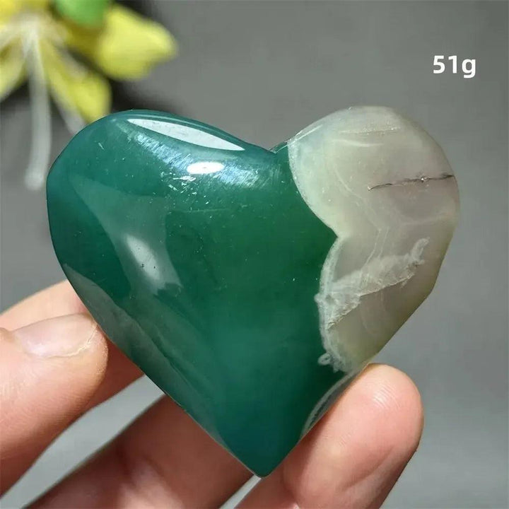 Green Cherry Agate Crystal Heart, 51g. Polished, heart-shaped stone with deep green and white flower-like patterns.