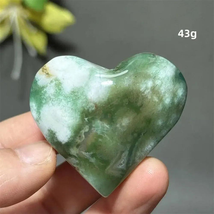 Green Cherry Agate Crystal Heart, 43g. Polished, heart-shaped stone with soft green and white flower-like patterns.