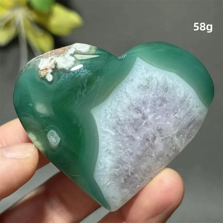 Green Cherry Agate Crystal Heart: Polished heart-shaped stone with mint green hues, white flower-like plumes, and a raw geode center.