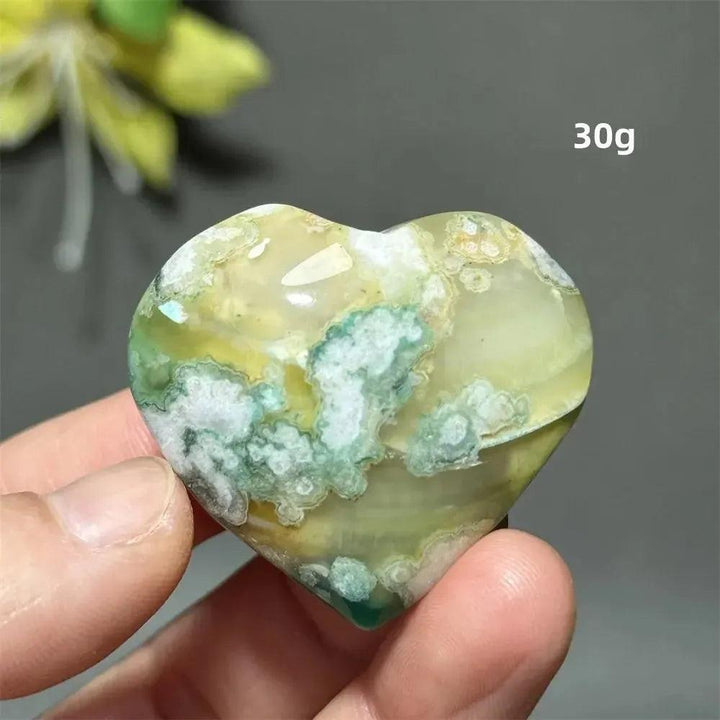 Green Cherry Agate Crystal Heart: Polished, heart-shaped stone with soft green, mint, and sage hues, unique flower-like plumes.