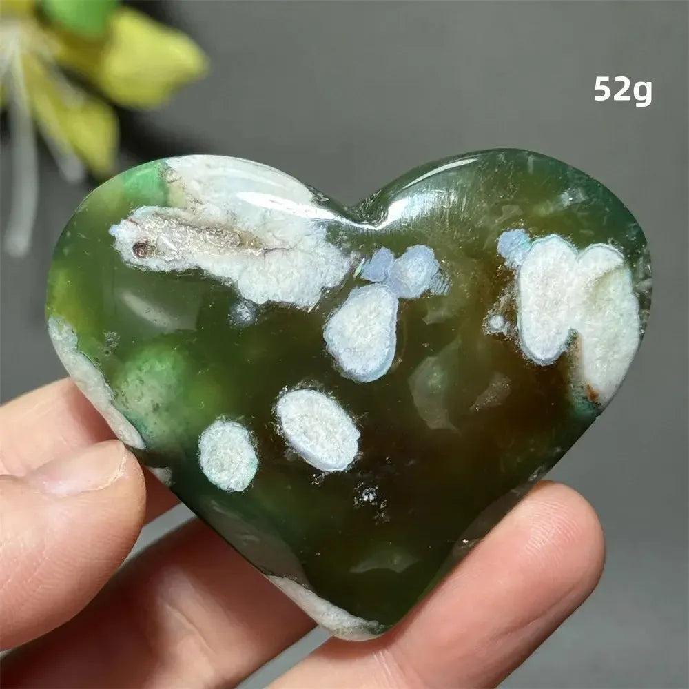 Green Cherry Agate Crystal Heart: Polished, heart-shaped stone with deep green hues and white flower-like patterns.