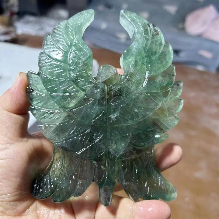 Hand-polished Green Fluorite Seraph Angel figurine with intricate wing carvings and luminous forest green hues.